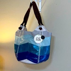 The SAK teal blue white leather brown purse. New w tags